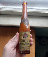 1906 JUICE OF LEMONS SICILY NY LABELED MINI "HOCK WINE" SHAPE BOTTLE HAND BLOWN