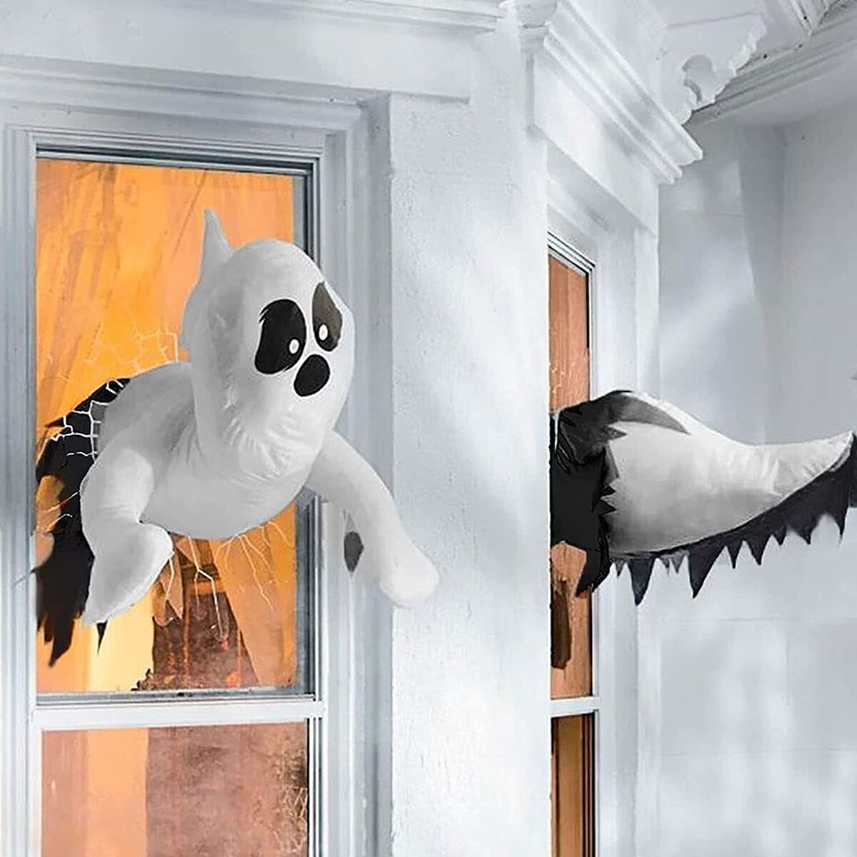 Cute Scary Ghosts Crash Through Window Glass Halloween Window outdoor decoration Transform your home into a spooky haunted house with these cute yet scary ghosts crashing through your window glass. Perfect for Halloween, these outdoor decorations will give your house a frightful touch that will delight trick-or-treaters and party guests alike.