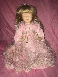 praying porcelain doll
