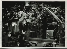 1983 Press Photo Workman Welding in General Motors Assembly Plant, Massachusetts