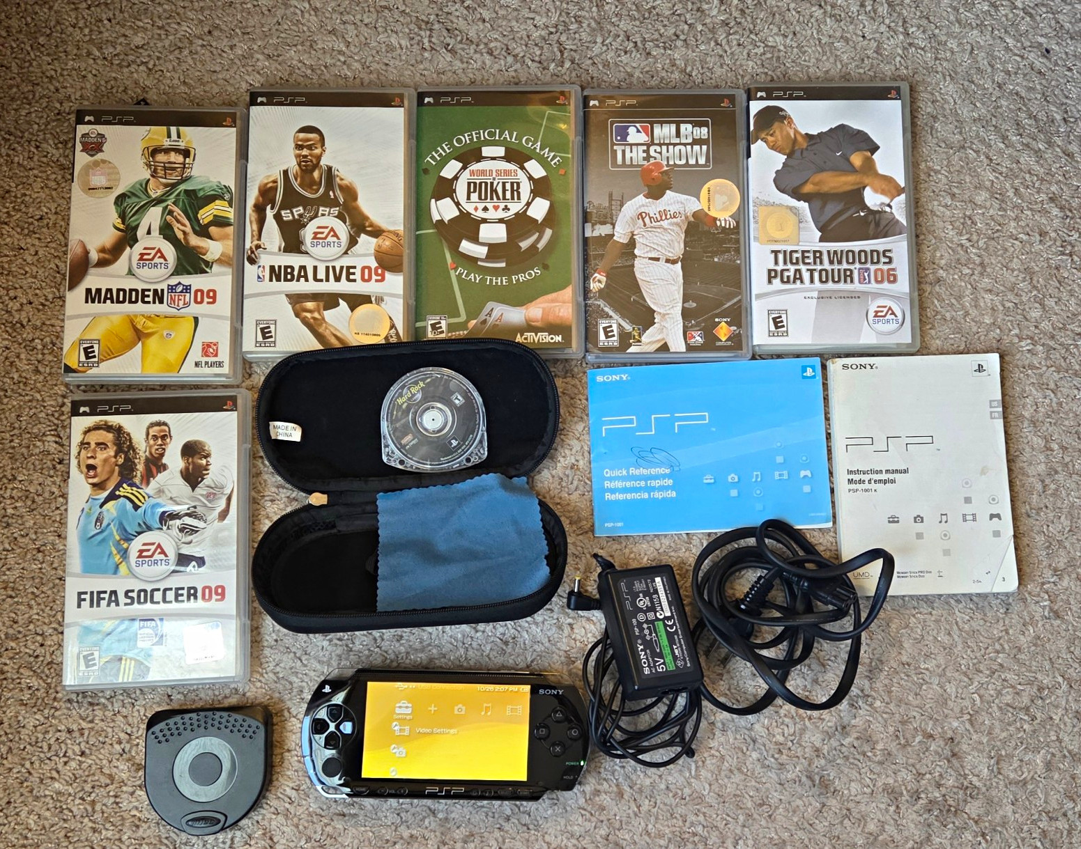 Sony PSP-1001 Console Bundle w/ AC Adapter, Manuals, 7 Games FIFA Madden NBA.