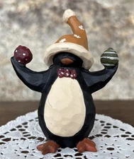 Suzi Skoglund? Penguin Figurine Stocking Cap, Bow Tie, Holding 2 Balls