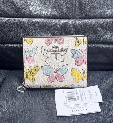 COACHミニ財布　butterfly柄 NWT COACH Lovely Butterfly Print Zip Corner Wristlet midnight Blue