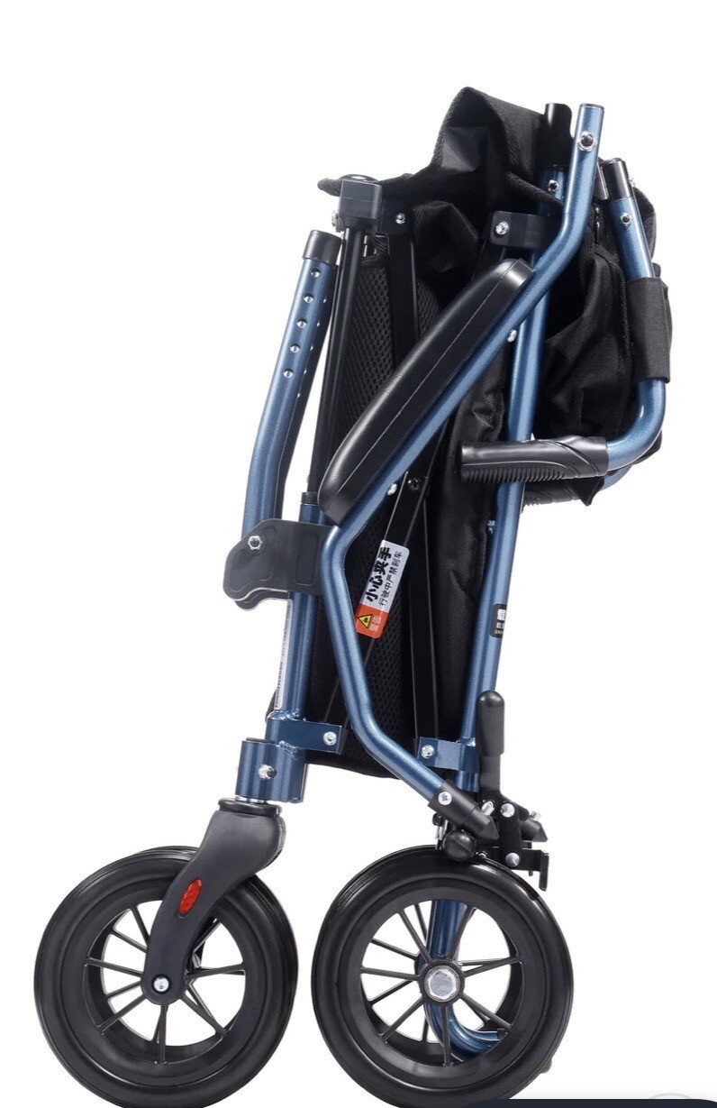 New HECARE Ultra Lightweight Folding traveLite transit wheelchair in a