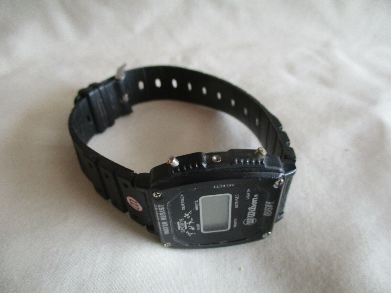 Wilson Digital Wristwatch with a Buckle Band and 100ft Water Resistance