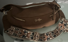 Brown Crescent Shoulder Bag with Detachable Patterned Strap and Gold Hardware