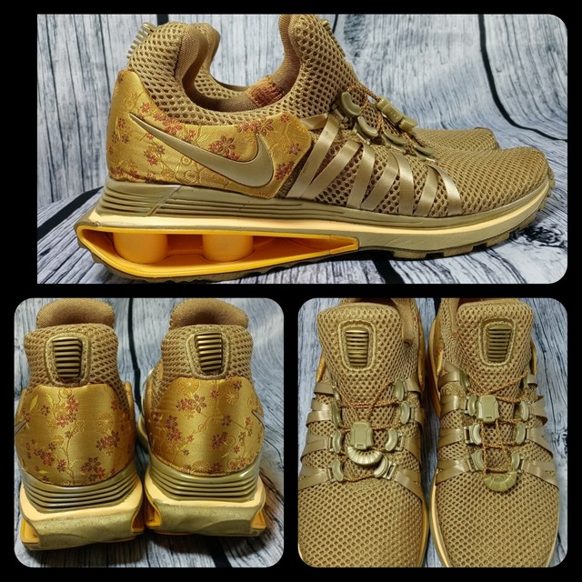 nike shox gravity women's gold