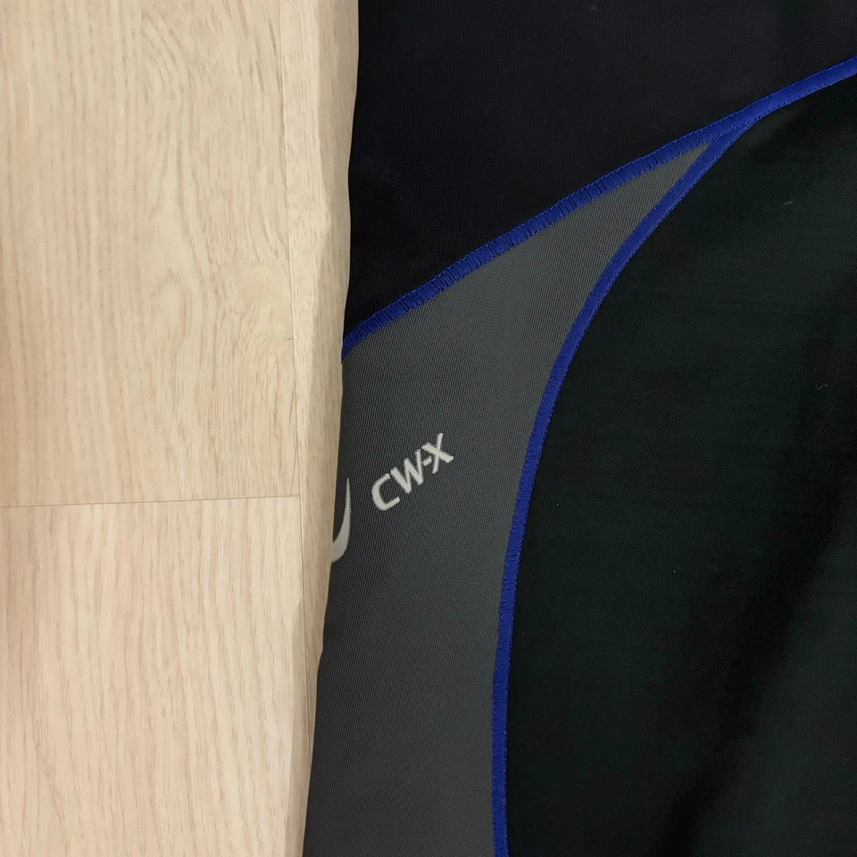 Meia-calça de compressão masculina CW-X preta StabilyX suporte articular L #225809A joelhos centrais - Imagem 3 de 4