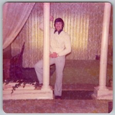 Vtg Color Snapshot Man In White Sweater & Trousers Leaning On Pillar Room 1977