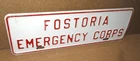 EMERGENCY CORPS -- FOSTORIA - OLD VINTAGE ORIGINAL SIGN License Plate TAG TOPPER
