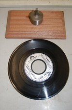 Dinker for jukebox records --cuts clean accurate holes easily.