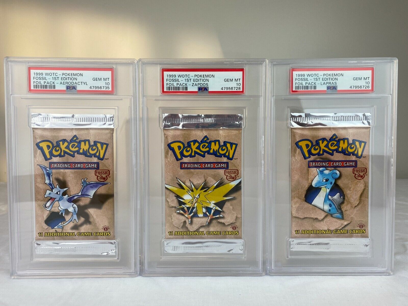 PSA 10 Pokemon 1st Edition Fossil Complete Set All 3 Booster Packs *NEW  CASES* | eBay