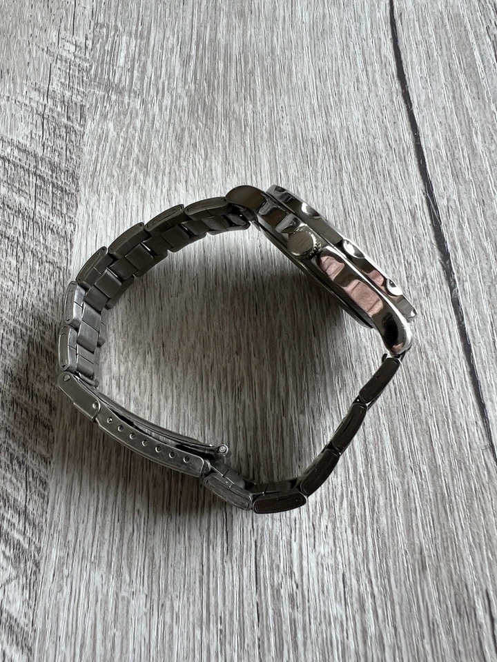 Reloj unisex Paris Hilton de cuarzo plateado con esfera azul correa de acero Foto 4 de 4