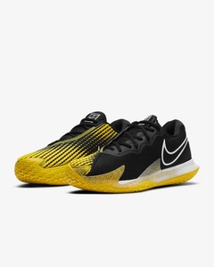 black and yellow nike tennis shoes