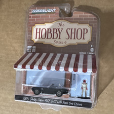 GreenLight Hobby Shop S4 1:64 1965 Shelby Cobra 427 S/C + Race Car Driver LE