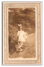 Little Girl and Her Dog Standing in the Road UNP Postcard XC7