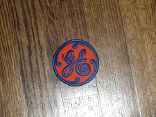 general electric (ge),orange  backround/ blue  letters, 2.75"x2.75",nos, 1960's