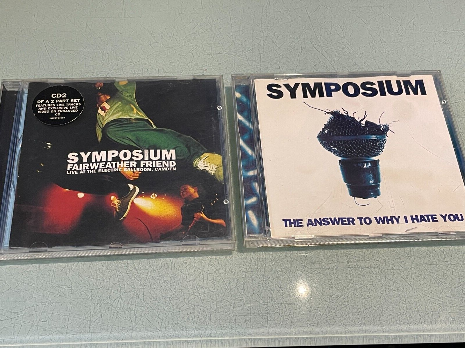 Symposium - 2 CD Singles - The Answer To Why I Hate You & Fairweather Friend