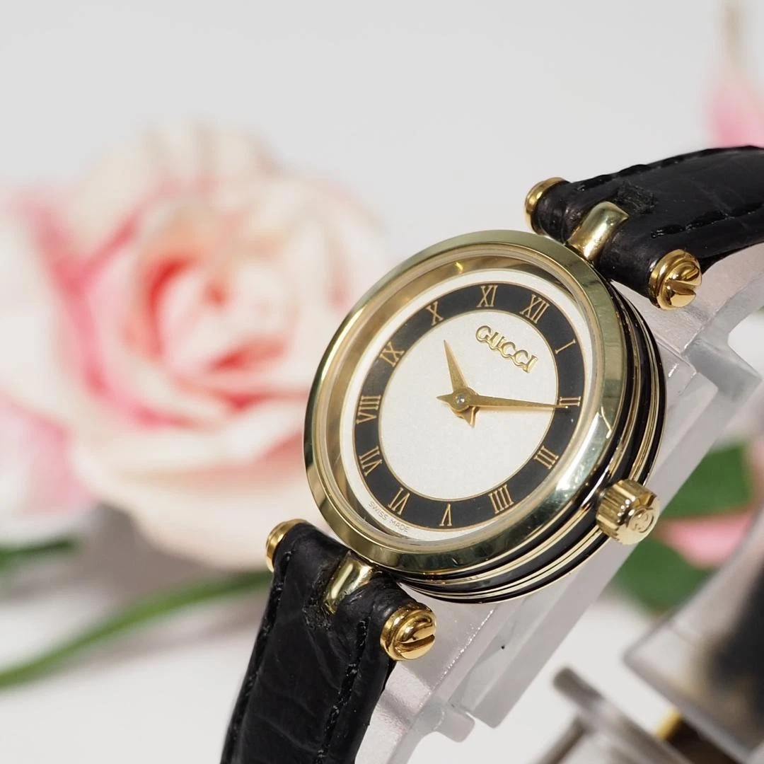 Montre femme Gucci Sherry Line ceinture cuir or 628