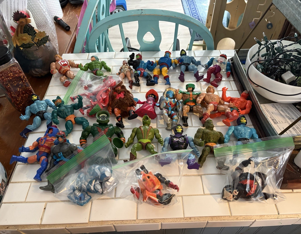 A genuine vintage He-Man/Masters of the Universe figure lot with accessories — pure 80s gold that hits any elder millennial right in the childhood.