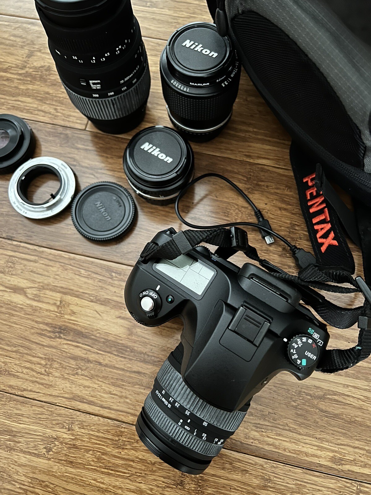 Pentax K10D digital camera with lots of lenses charger and Lowepro