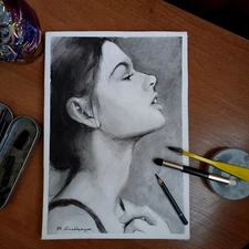 Original charcoal drawing. Illustration of a beautiful brunette in profile