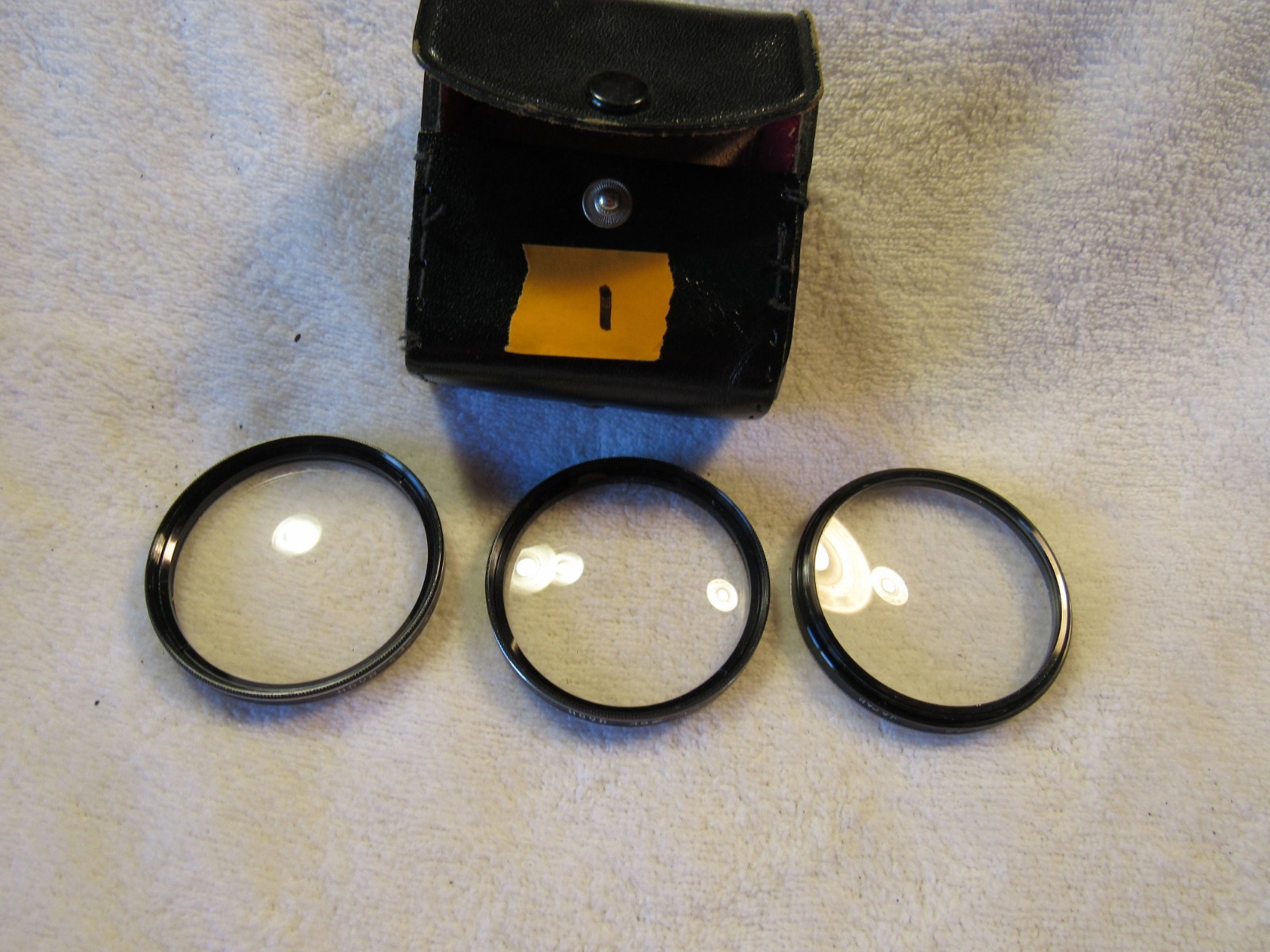 Cannon AE 1 camera with yucksack and misc. attachments