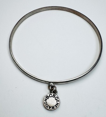 BCBGeneration Silver Tone Bangle Bracelet with Logo Charm