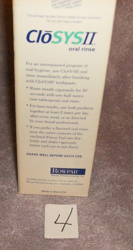 White CLYSOS II oral rinse bottle with blue cap, red “For an unsurpassed program of oral hygiene” text, and rowpar logo.