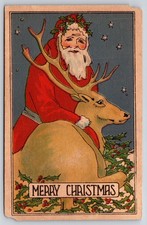 Christmas~Art Deco~Santa Claus Hugs Reindeer In Holly~c1910 Vintage Postcard