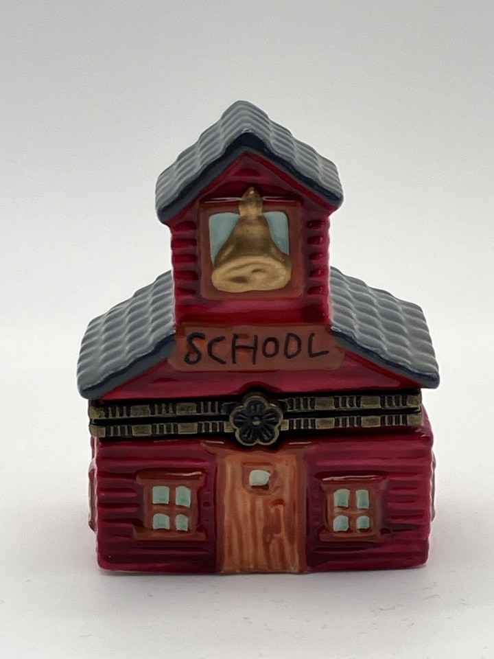 A rare miniature porcelain schoolhouse hinged trinket box that comes with two tiny trinkets inside — the kind of hyper-specific collectible that makes a dedicated collector gasp.