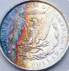 1887 P- fantastic natural rainbow Toning. BU Morgan Silver Dollar.