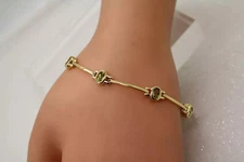 FAS gold over .925 S.S. PERIDOT OVAL BAR LINK DESIGN bracelet 7"