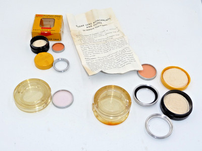 set of Kodak Series IV and V adapter rings and filters
