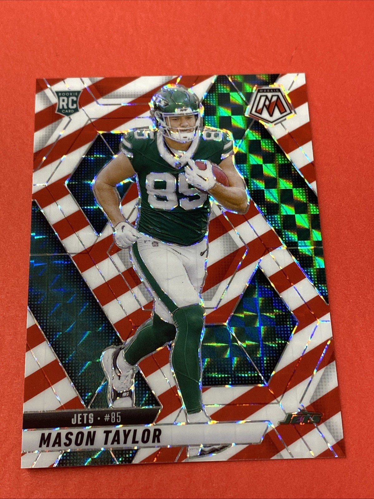 2025 Panini Mosaic Mason Taylor Red & White Stripe Mosaic Prizm RC #324 JETS