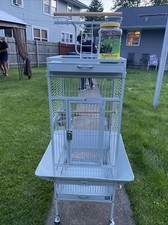 bird cage large.  This Cage Was Used For Maybe 3-4 Months includes Bird Food 
