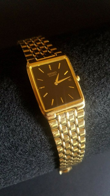 seiko gold watch black face