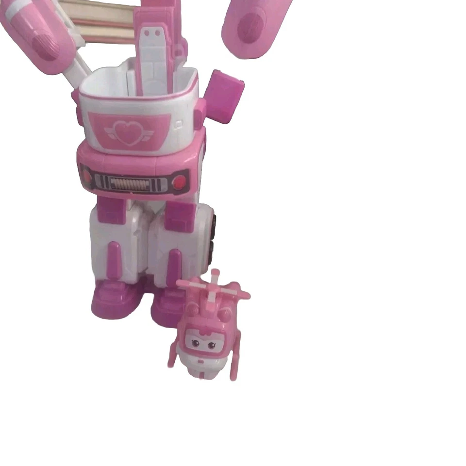 Remolque de rescate Super Wings Dizzy's con mini figura rosa y avión transformador Foto 4 de 4