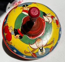 Antique Tin Spinning Top Toy Plunger w/Dutch Children Ice Skater Ski Made in USA