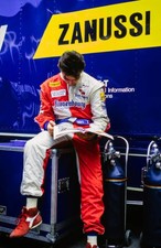 Olivier Beretta reads a magazine Spanish GP at Circuit de Barcelon- Old Photo