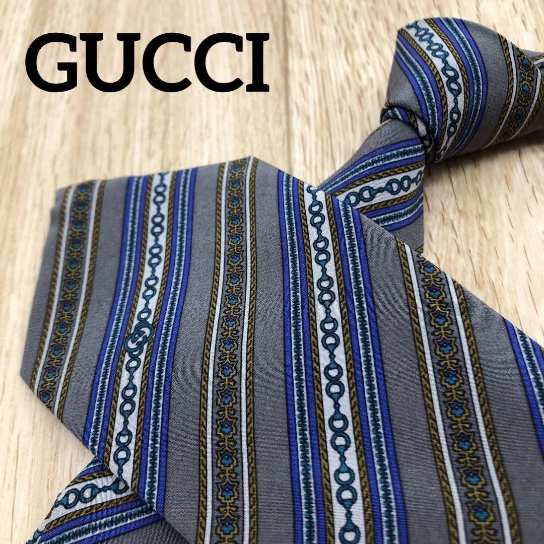 Magnifique cravate GUCCI 3,34 pouces gris mors de cheval soie
