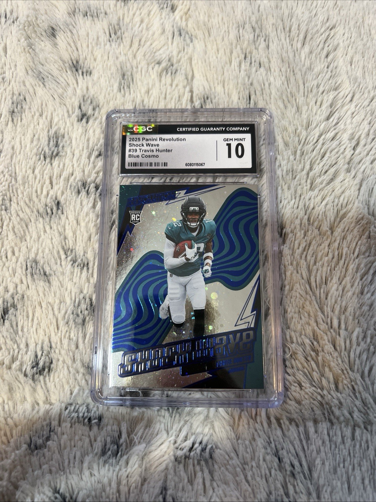 2025 Panini Revolution Shock Wave #39 Travis Hunter Blue Cosmo Numbered To /15