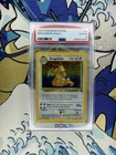 1999 POKEMON FOSSIL #4 DRAGONITE-HOLO PSA 4