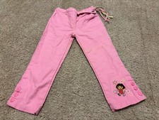 Vintage pink girls' embroidered pants featuring the character Dora the Explorer