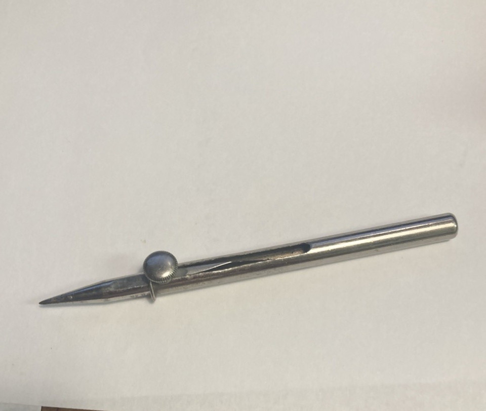 A 1910-patented reversible pocket scrip/knife — a genuine century-old EDC artifact with a quirky dual-purpose design you won't find at any hardware store.