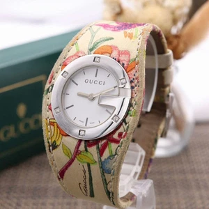 Montre GUCCI 104/2005 6P ceinture brodée fleurs diamant occasion avec pile neuve
