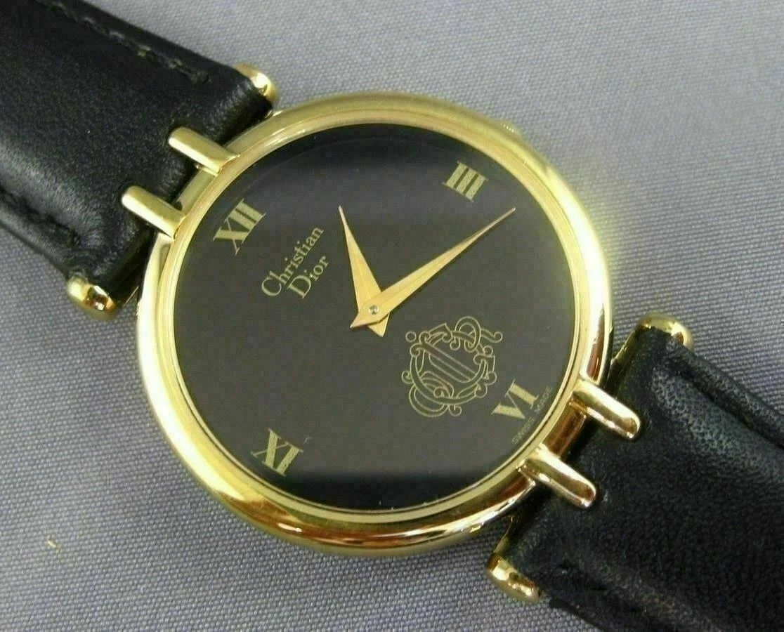 MONTRE CLASSIQUE À CHIFFRES ROMAINS RONDS CLASSIQUES FABRICATION SUISSE CHRISTIAN DIOR #26004