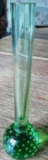Vintage green art glass bud vase with a controlled bubble base