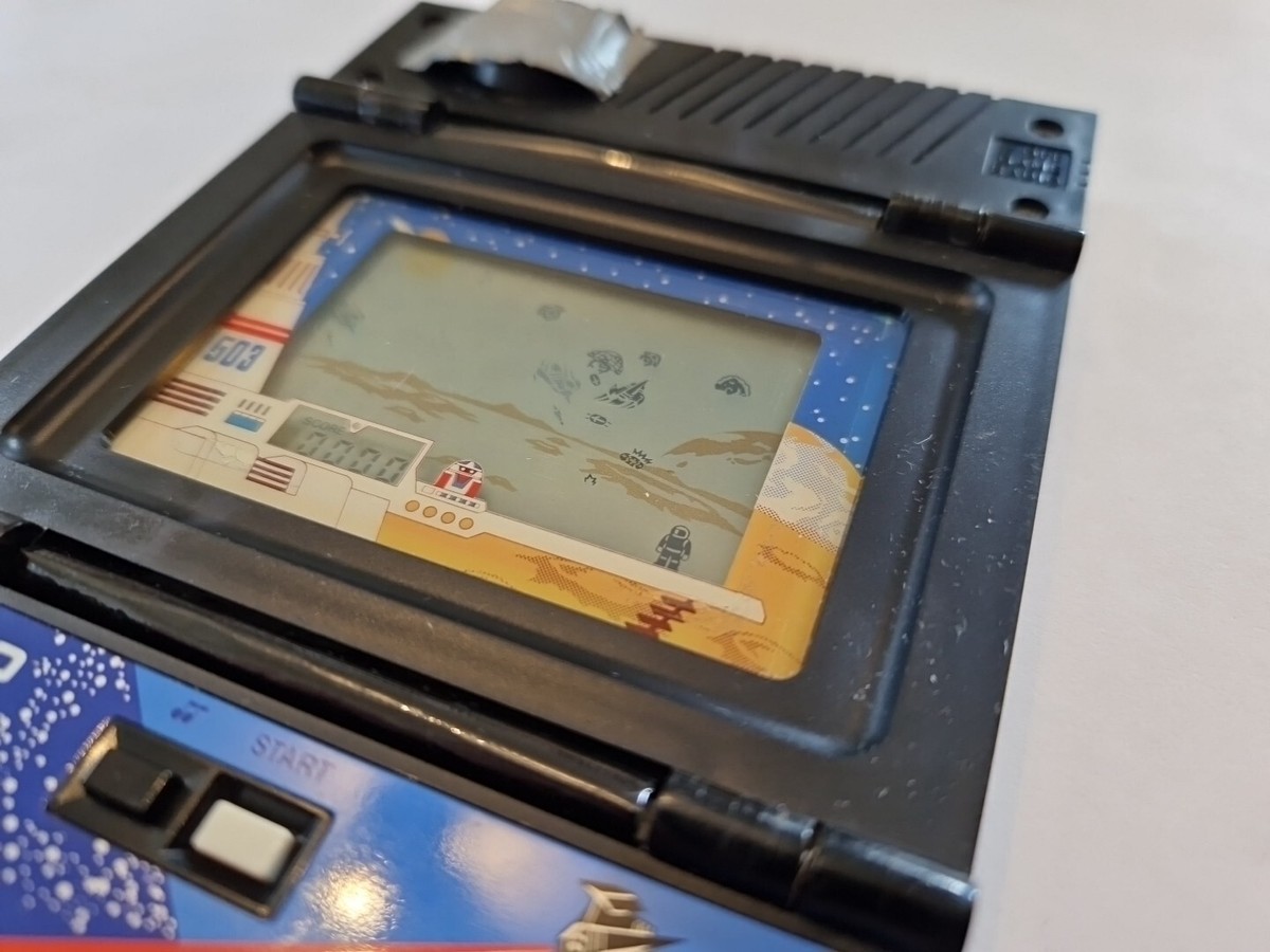 Casio 1983 CG-70 Shuttle Bomber Electronic Handheld Video LCD Game