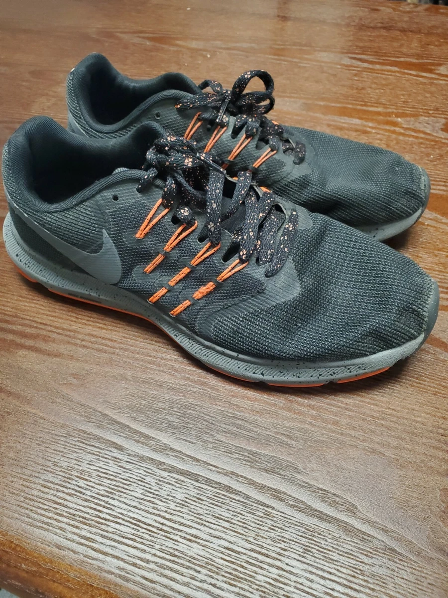 Nike run swift black and orange sale